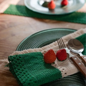 Christmas woven cotton placemat with green and cream stripes and decorative tassels