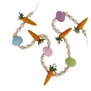 Detail of Easter wooden bead garland with orange carrots and colorful eggs on twine