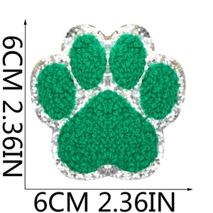 Detail of green chenille dog paw patch with silver sequins, 6cm size embroidery detail