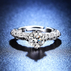 Close-up of S925 silver moissanite ring with twisted pave band and four-prong setting
