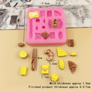 Detailed view of pink silicone bread mold with dimensions for mini croissants and waffles