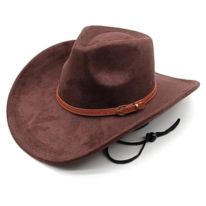 Detailed view of brown suede cowboy hat featuring leather band and adjustable chin strap