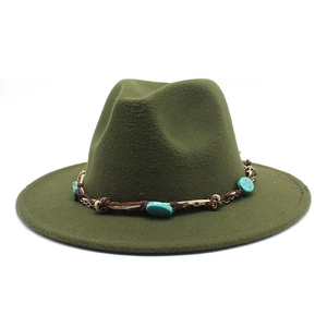 Close-up of deep green wool fedora with bohemian turquoise beads and woven leather band