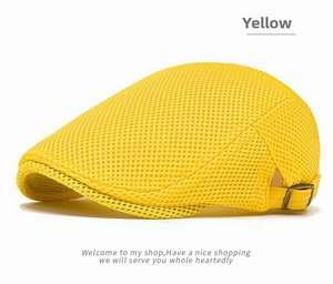 Detailed view of yellow breathable mesh beret with side metal adjustment buckle