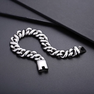 Close-up of silver twist chain link bracelet with vintage clasp in stainless steel