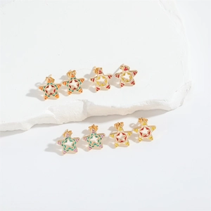 Star-shaped cutout stud earrings with colorful enamel stripes on a gold metal base