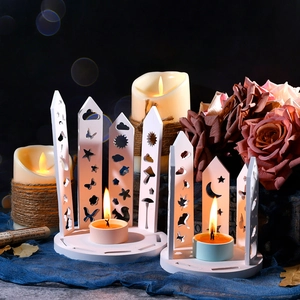 Detail of DIY animal silhouette hollow candle holder molds with tea light candle scene