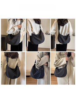 Multiple views of a large black waterproof Oxford crossbody crescent bag on a model