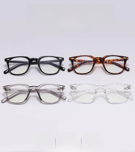 Detailed view of square retro eyeglass frames in black, tortoiseshell, grey and clear