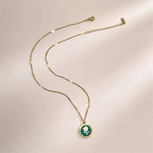 French vintage daisy necklace in gold plated titanium steel with green enamel flower pendant