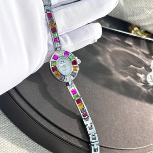 Detailed shot of silver ladies watch featuring colorful zircon stones on the bracelet