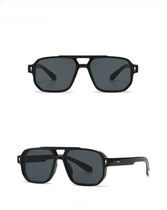 Front and 45-degree side view of vintage black sunglasses with rivet detail