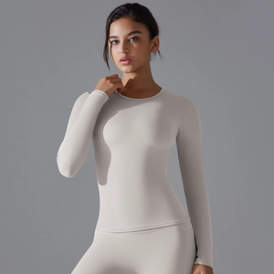 Close-up of slim fit long sleeve yoga top with breathable elastic knitted texture
