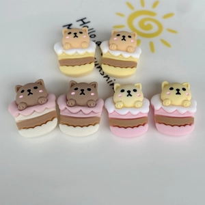 Macro detail of cute resin cartoon animal cupcake DIY charms for phone cases and accessories