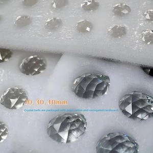 Detail of faceted crystal balls in protective foam packaging for safe shipping