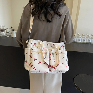 Casual large canvas tote bag with red cherry print and multiple zipper pockets