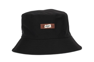 Detail of black cotton canvas bucket hat featuring a brown 1903 patch embroidery