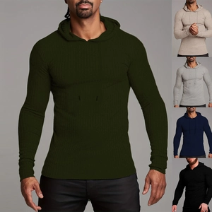 Detail of slim fit men's ribbed knitted hoodie showing vertical texture and drawstring