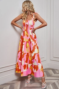 Detail of floral print maxi dress featuring lace-up straps and elastic ruched bodice