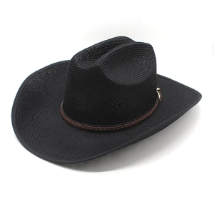 Detail of black straw cowboy hat featuring dark brown woven band and gold buckle accent