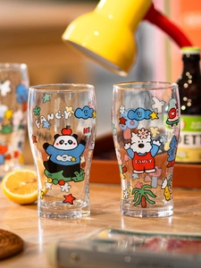 Close-up of glass mugs featuring colorful cartoon panda and dog prints with Fancy lettering