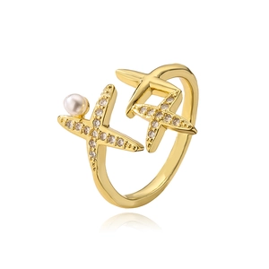 Detail of gold starfish open ring with white pearls and sparkling cubic zirconia stones