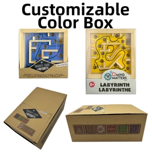 Detail of wooden labyrinth game with balance ball panels and kraft packaging box