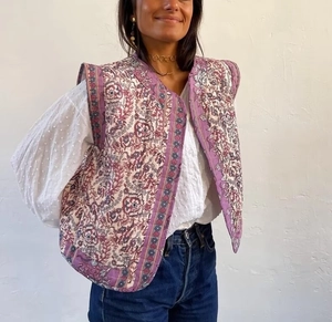 Detailed view of women's purple quilted vest with vintage street style ethnic prints