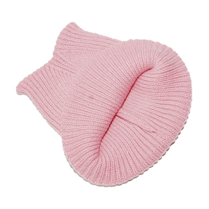 Detailed close-up showing the pink ribbed knit texture and warm material of the beanie