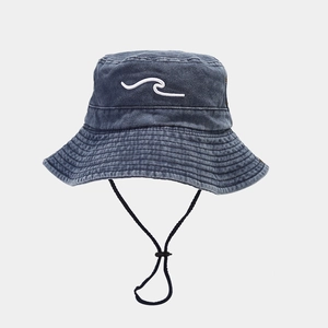 Detail of blue denim bucket hat with white wave embroidery and black adjustable wind rope