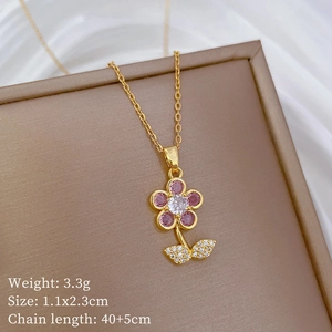 Macro detail of butterfly flower pendant with pink gemstones and size specifications