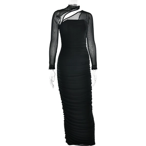 Detail view of black mesh patchwork dress with ruched design and cutout neckline