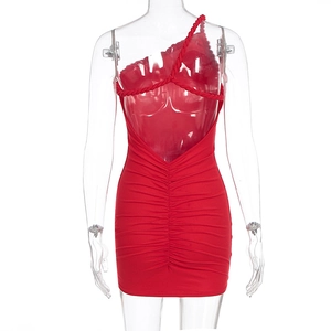 Detail of red ruched bodycon dress showing open back with cross straps and slim fit design