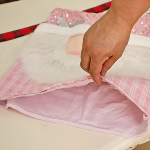 Pink Christmas chair cover with sequins and plush fabric for festive dining room decor