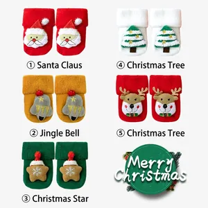 Five pairs of plush Christmas baby socks with 3D dolls featuring Santa and reindeer