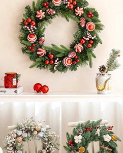 Detailed view of Christmas wreaths with berries, pinecones and ornaments for door decor