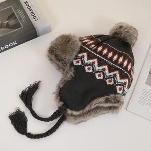 Close-up of knit trapper hat with orange geometric pattern and gray faux fur lining