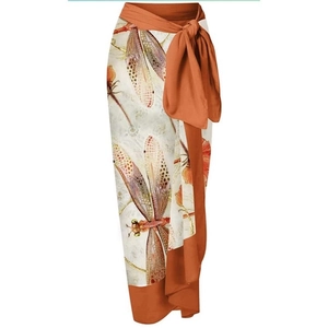 Detail of dragonfly print chiffon sarong with adjustable waist tie for beach resort wear
