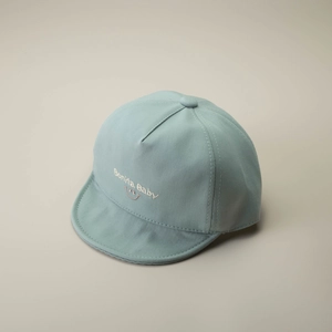 Detailed embroidery of Bonita Baby text and smiley face on mint green soft brim cotton cap