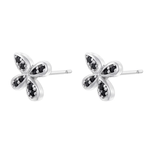 Close-up of silver flower stud earrings with black crystals and minimalist design