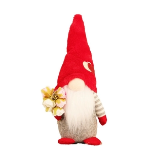 Handmade Valentine gnome plush with red heart hat and white beard holding flowers