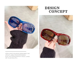 Detail view of Y2K sports sunglasses in blue and burgundy with durable frames