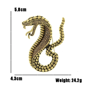 Detail view of vintage gold snake brooch with champagne rhinestones and 5.8cm height measurement