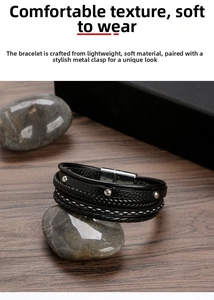 Detail view of multi-layer black braided leather bracelet with silver magnetic metal clasp