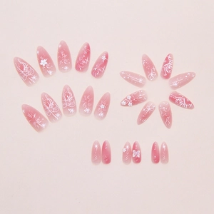 Pink gradient almond press-on nails with white floral, bow, and aurora butterfly art