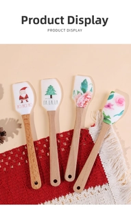 Christmas silicone spatula set with wooden handles on a cozy knit mat for baking decor