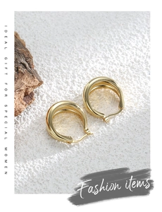 Detailed view of gold-plated multi-layer hoop earrings with S925 sterling silver stamp