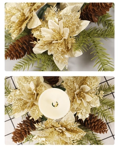 Detail of Christmas candle ring with gold glitter flowers, pine cones and green needles