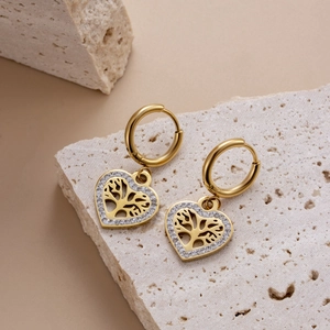 Gold heart hoop earrings with tree of life design and sparkling stones on stone