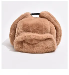 Detail of plush faux fur trapper hat in khaki with thick winter thermal lining